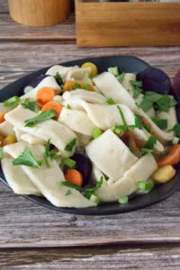 Homemade egg noodles cooked to perfection and ready to enjoy.