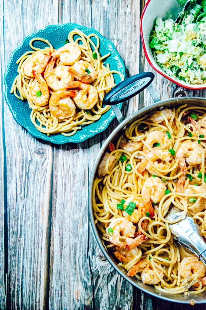 Skillet filled with sizzling shrimp in a golden butter garlic sauce, ready to serve.