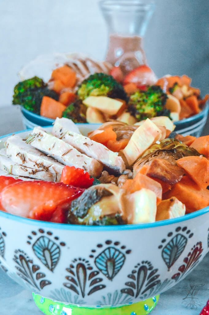 Quick tangy strawberry chicken farro bowl with roasted root veggies, grilled chicken, strawberries, and farro.